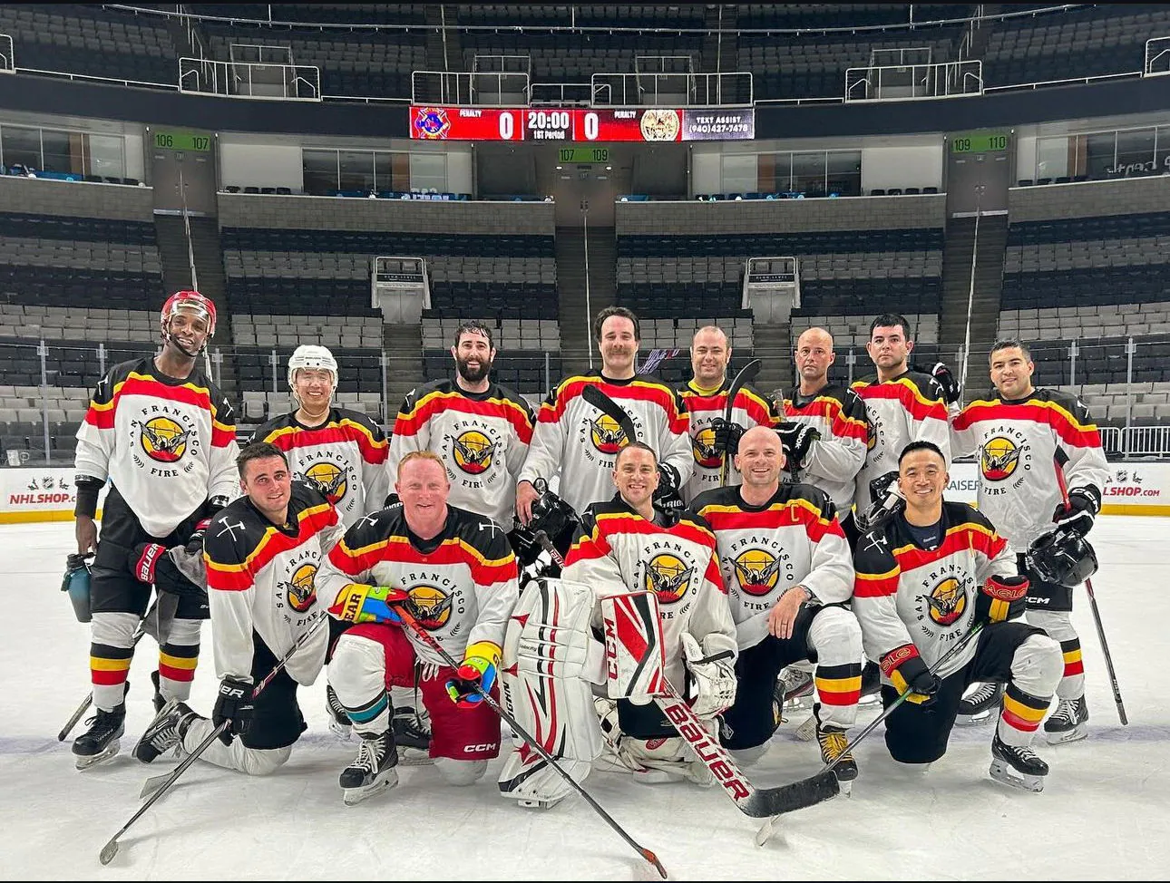 The hockey club lined up on the ice in an empty arena