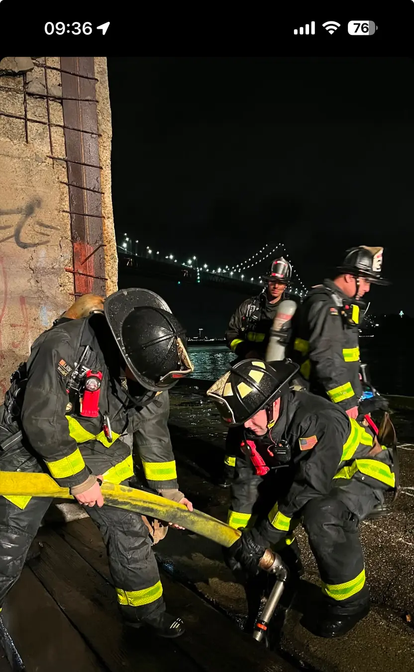 Firefighters with hose